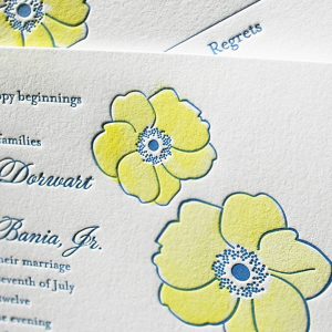 Hand painted letterpress wedding invitations with flowers.
