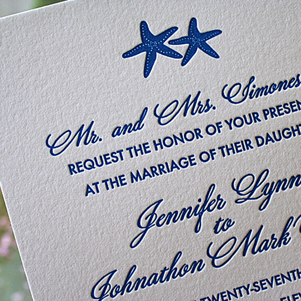 Elegant beach wedding invitations with letterpress starfish.