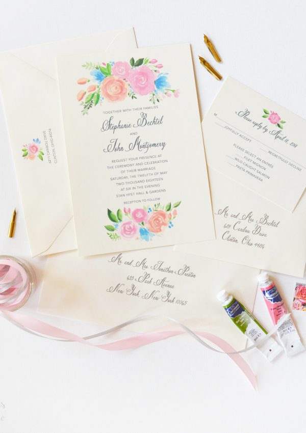 Beautiful floral wedding invitations with peach and pink roses. Perfect for a summer wedding!