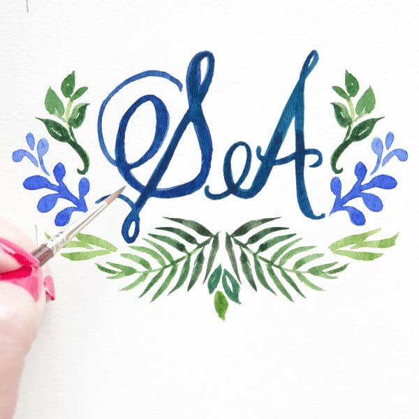 Custom hand-painted watercolor wedding monogram by artist Michelle Mospens. - Mospens Studio