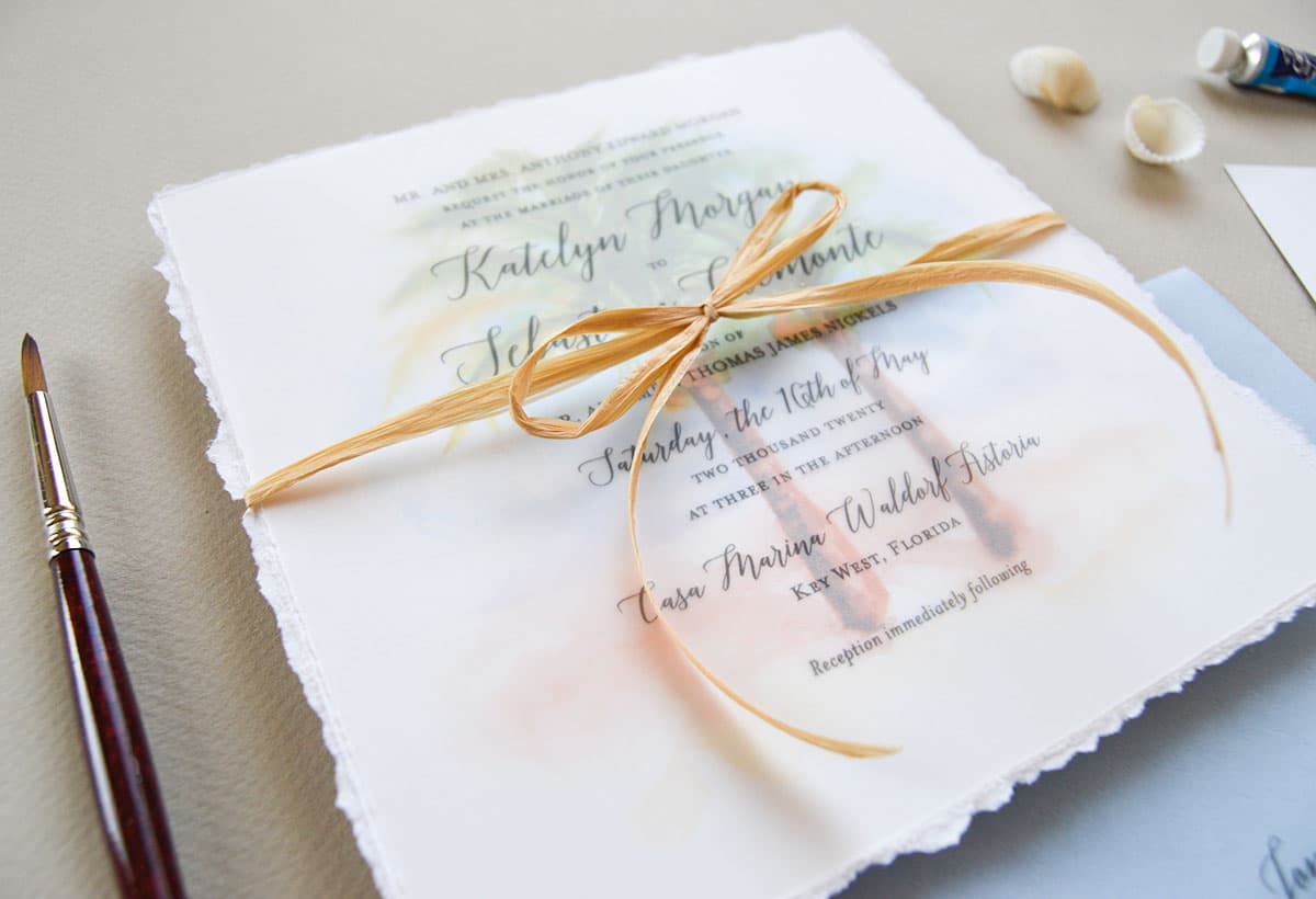 Beautiful beach wedding invitation with original palm trees and seashell watercolor art by artist Michelle Mospens. Perfect for a tropical destination wedding. - Mospens Studio