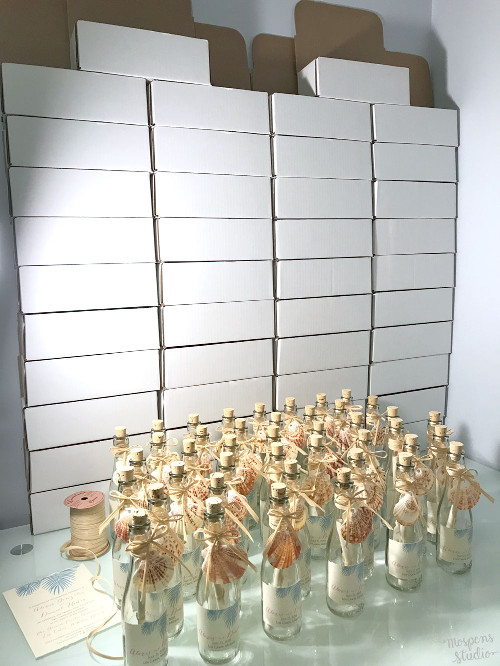 Beautiful beach wedding invitations in bottles by Mospens Studio.