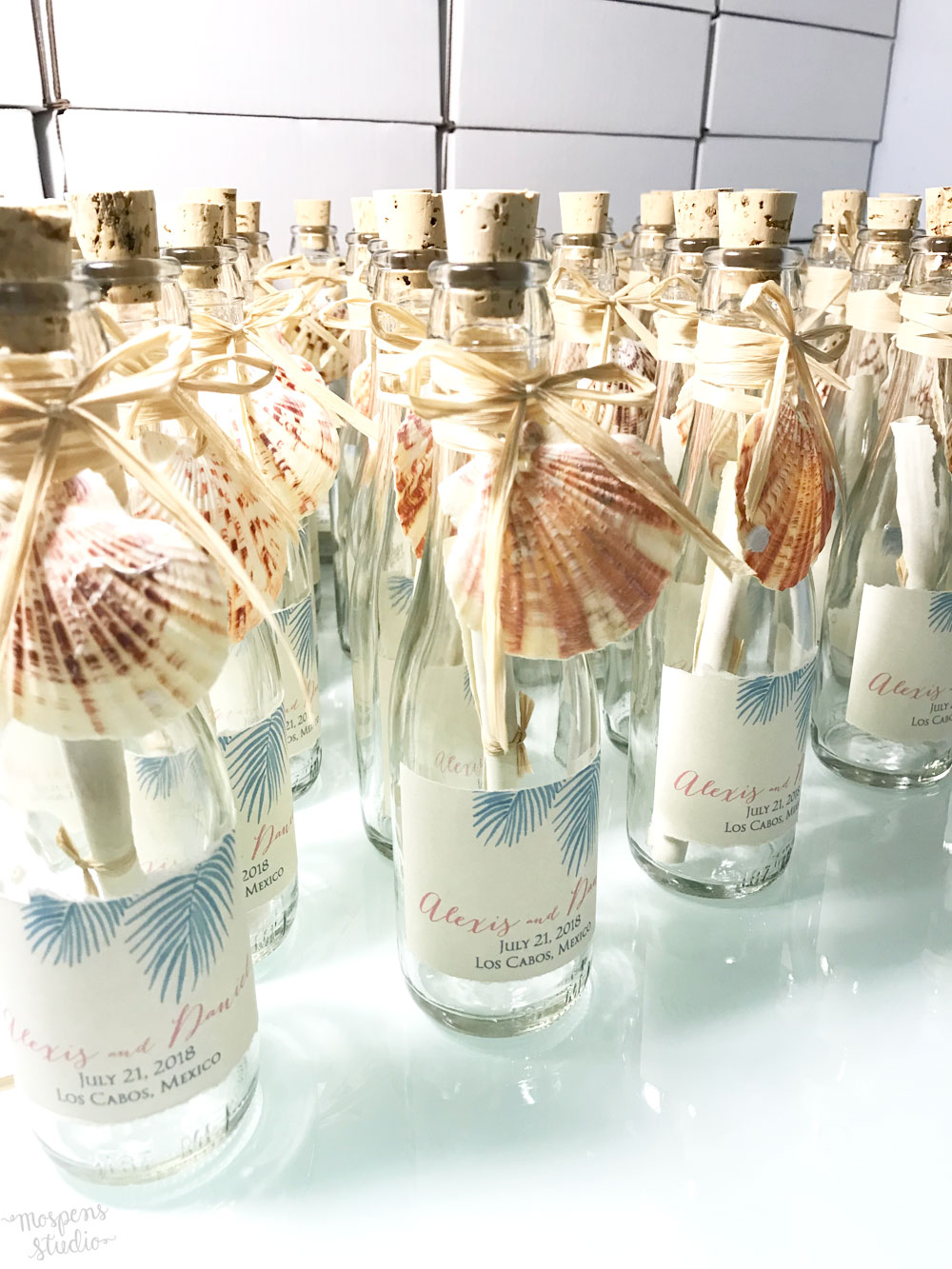 Beautiful beach wedding invitations in bottles by Mospens Studio.