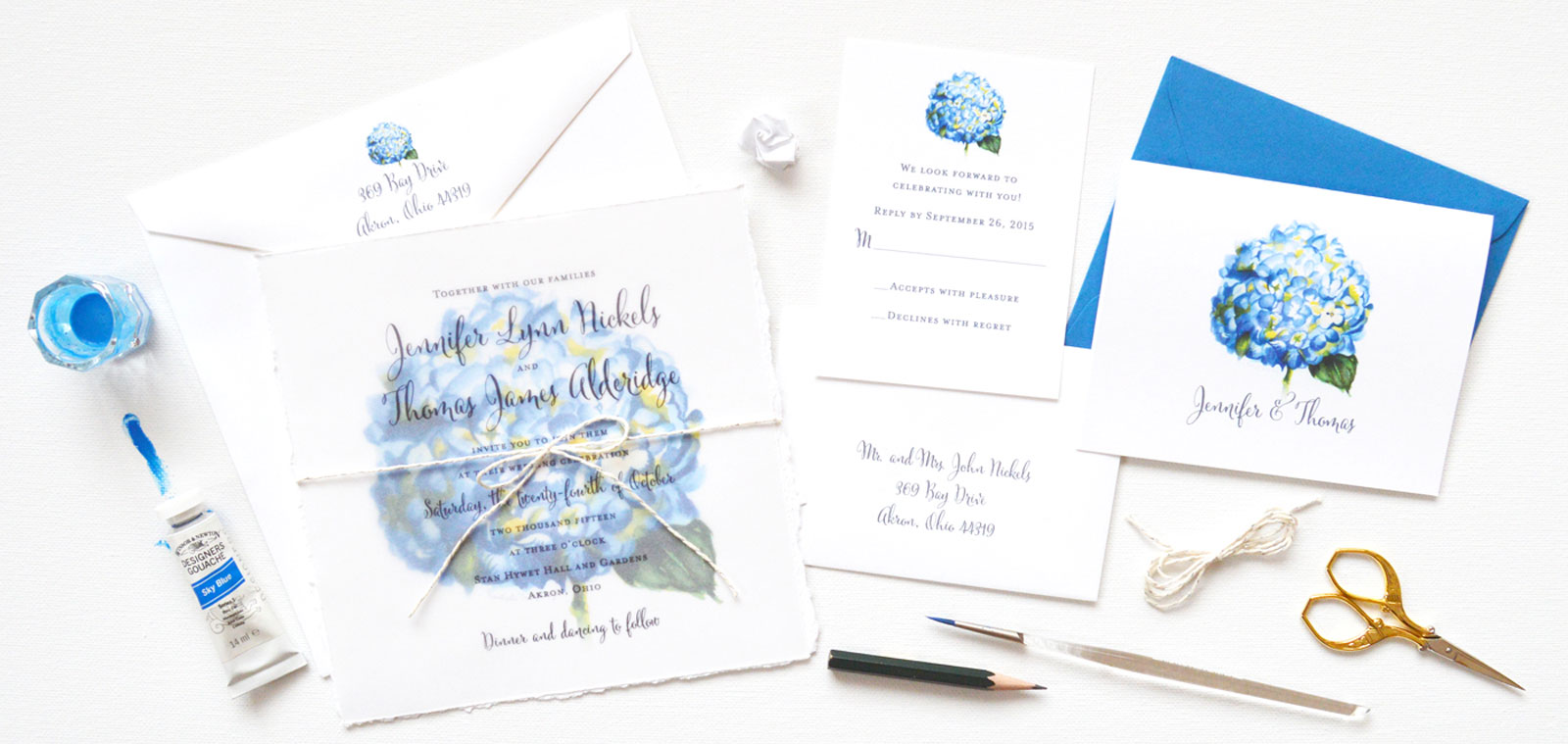 Unique floral wedding invitations with watercolor hydrangea flowers by artist Michelle Mospens.