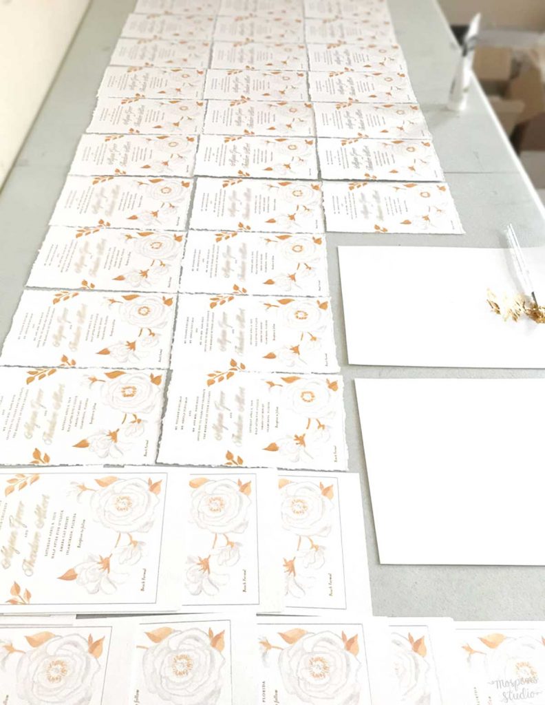 Hand-painted gold metallic floral beach wedding invitations with gold foil printing for an Islamorada, Florida wedding by artist Michelle Mospens. - Mospens Studio