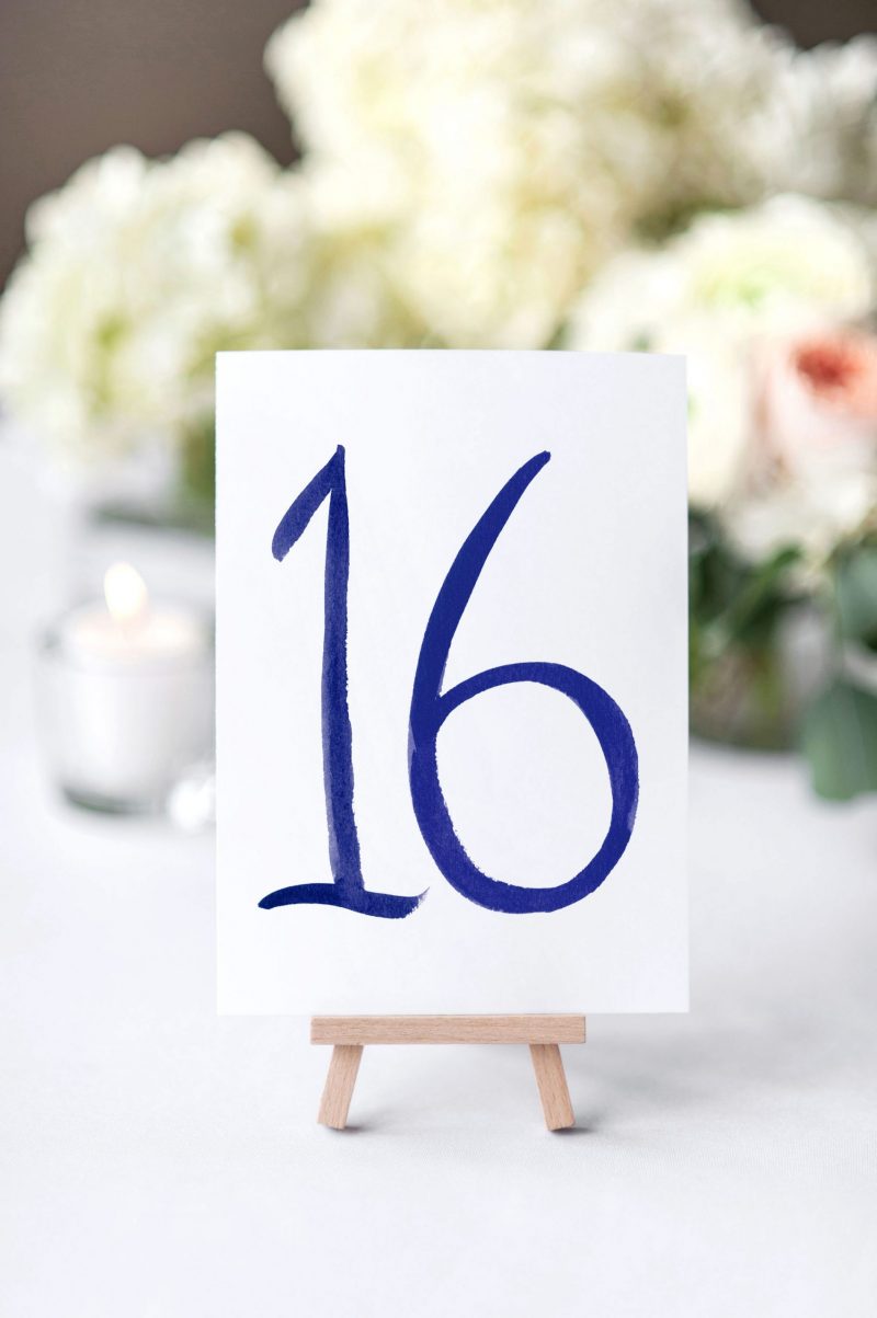 Hand-Painted Brush Lettering Table Number Cards by artist Michelle Mospens. Mospens Studio