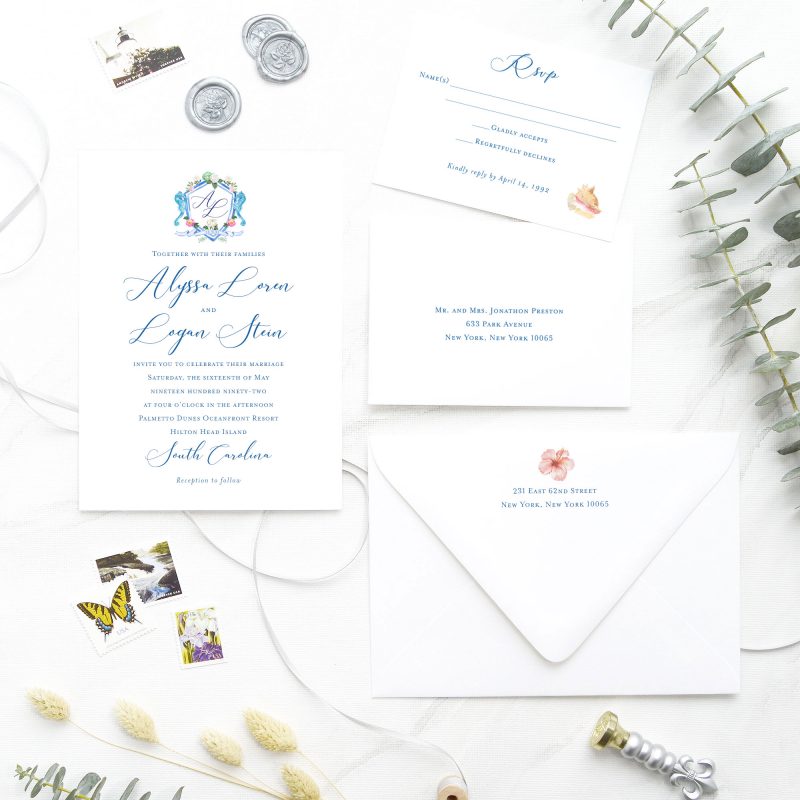 Nautical lovers, rejoice! These stunning beach wedding stationery feature painted wedding crest in watercolor, accented with flowers, seahorses, and beachy hues. Nautical Nuptials inviting wedding invitation is sure to drive your guests out of their shell. Perfect for a memorable coastal themed wedding and reception.