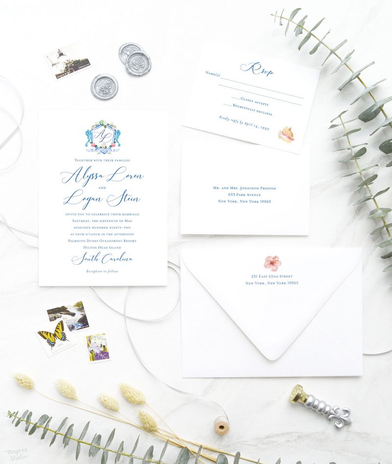 Nautical lovers, rejoice! These stunning beach wedding stationery feature painted wedding crest in watercolor, accented with flowers, seahorses, and beachy hues. Nautical Nuptials inviting wedding invitation is sure to drive your guests out of their shell. Perfect for a memorable coastal themed wedding and reception.