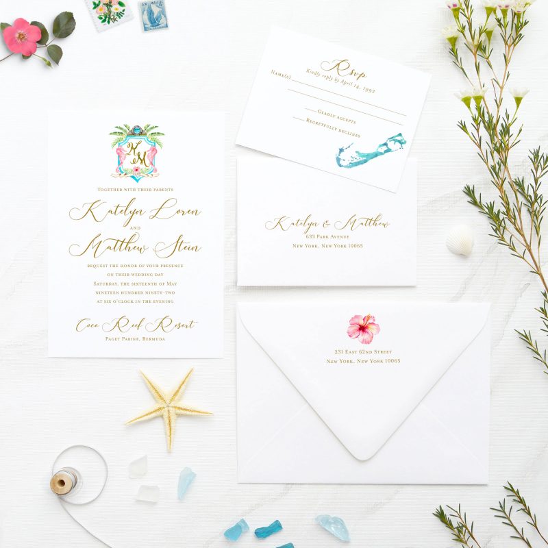 This Bermuda beach wedding invitation suite features hand-drawn wedding crest, accented with seahorses, moongate, hibiscus, and watercolor strokes. Bermuda inviting wedding invites are festive with whimsical crest and calligraphic touches. Perfect for a memorable destination wedding and reception in Bermuda.