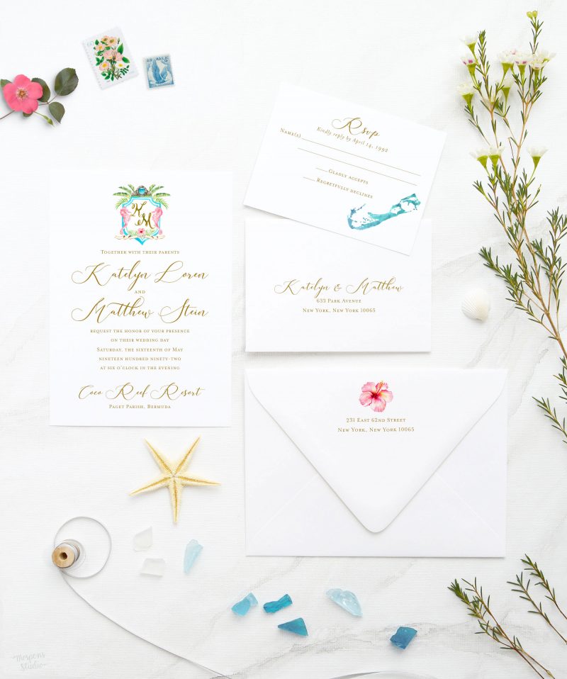 This Bermuda beach wedding invitation suite features hand-drawn wedding crest, accented with seahorses, moongate, hibiscus, and watercolor strokes. Bermuda inviting wedding invites are festive with whimsical crest and calligraphic touches. Perfect for a memorable destination wedding and reception in Bermuda.